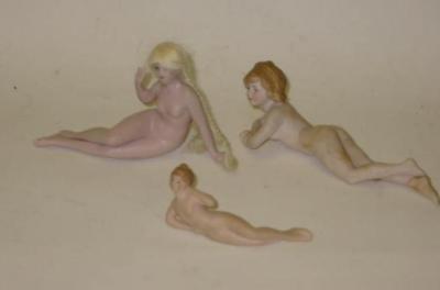 Appraisal: Three bisque bathing belles each nude one with blonde plaited