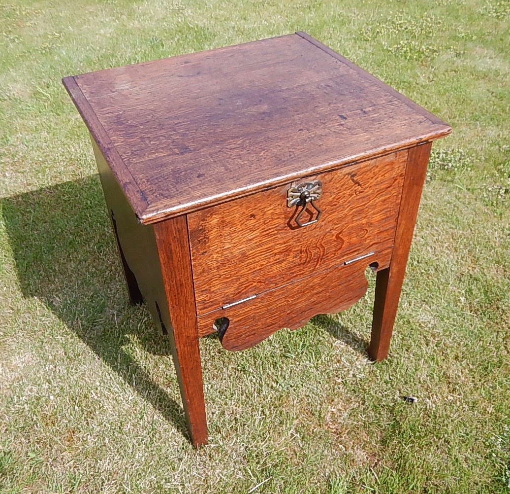 Appraisal: A George III oak pot cupboard with square top and