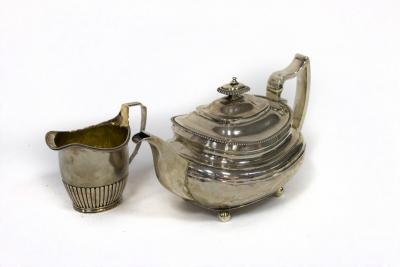 Appraisal: A George III silver teapot SH London and a cream