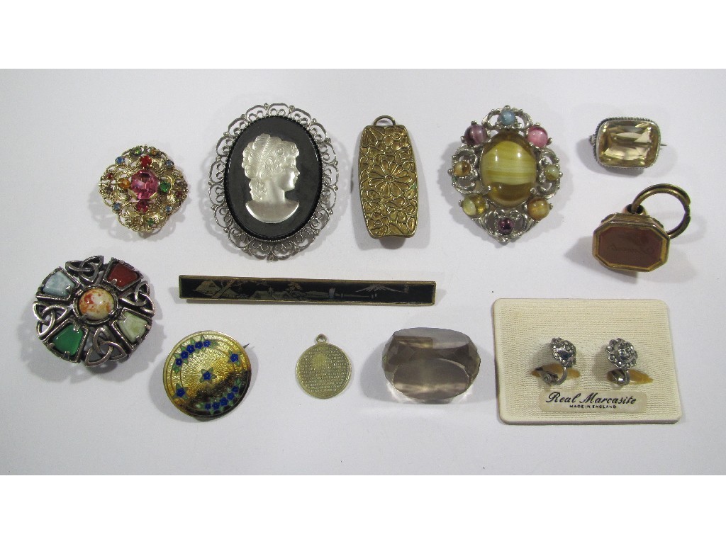 Appraisal: Lot comprising a gilt metal cornelian set intaglio fob and