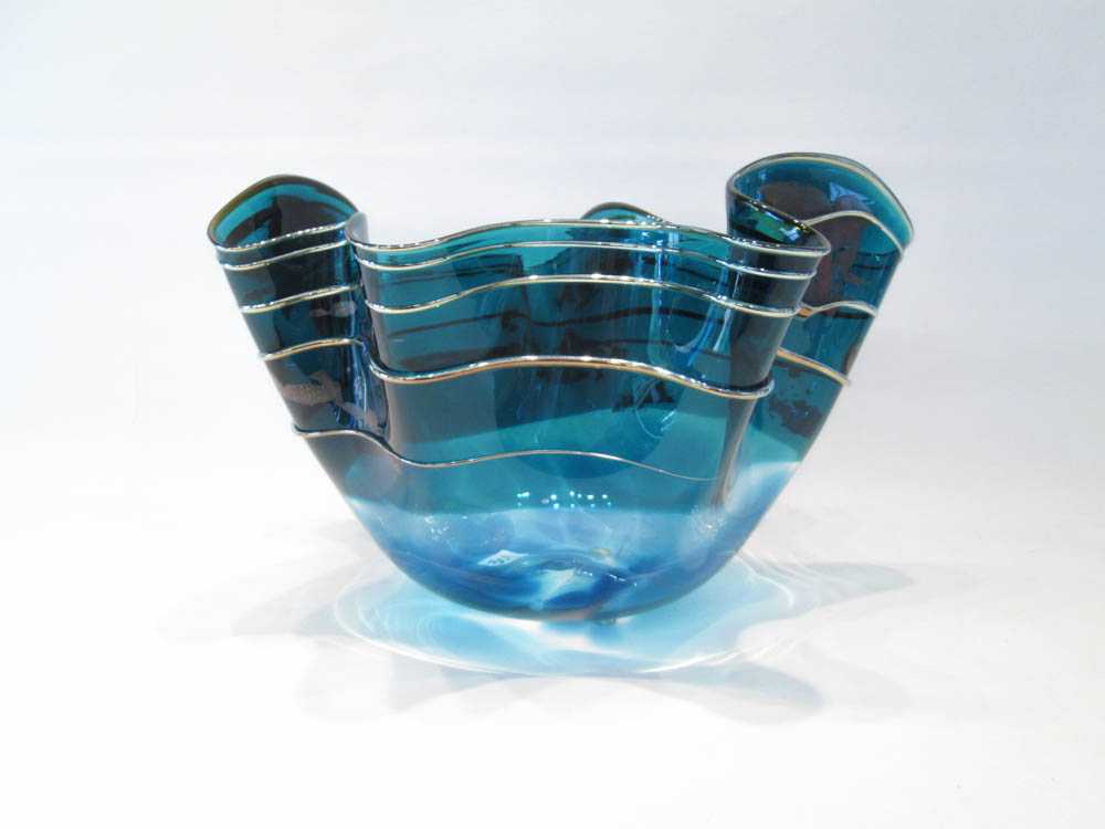 Appraisal: SIGNED STUDIO ART GLASS BOWL transparent blue with iridescent accents