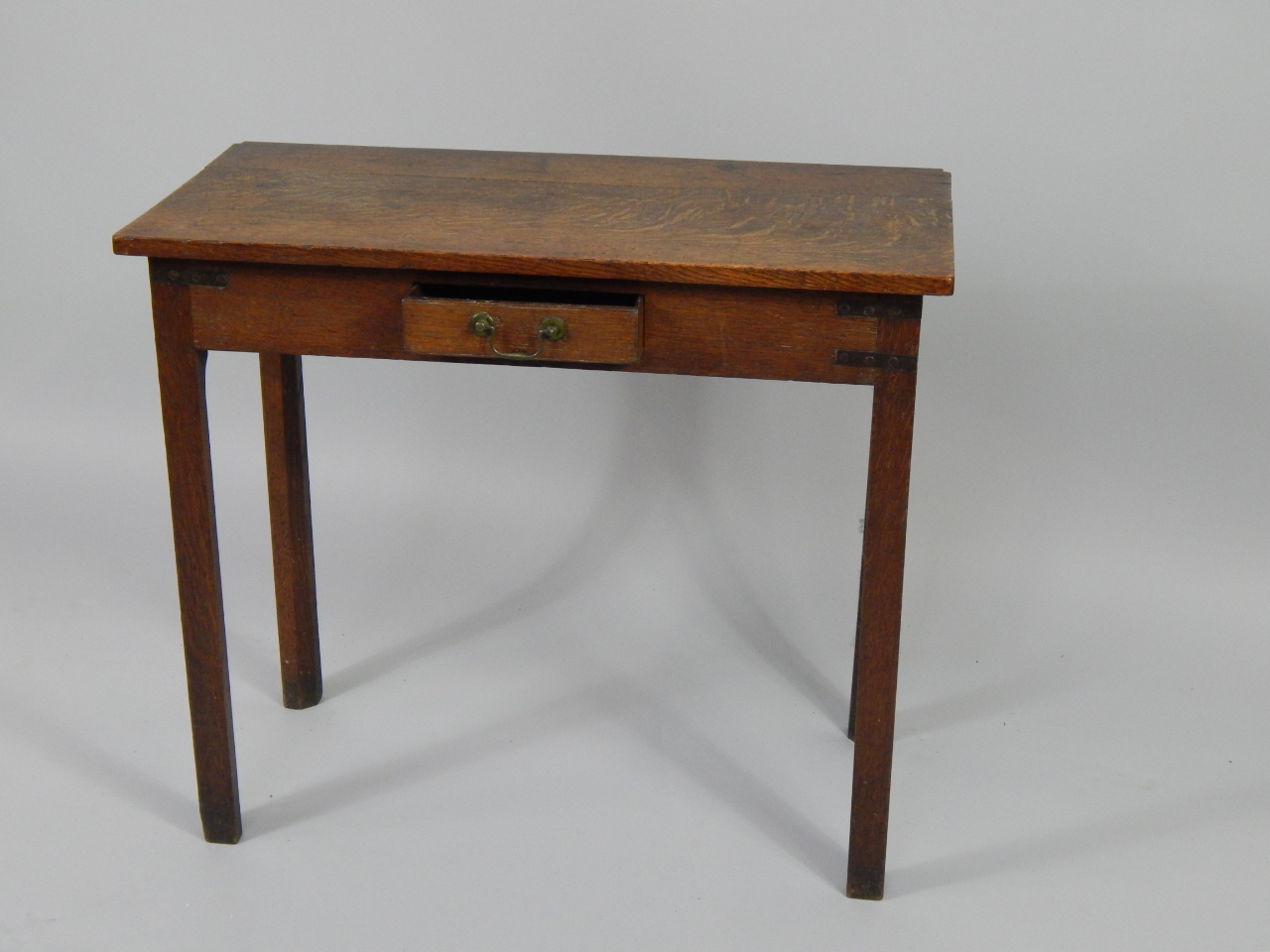 Appraisal: A George III oak side table with single frieze drawer