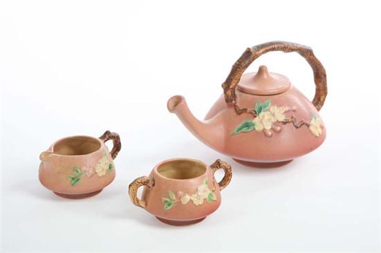 Appraisal: ROSEVILLE TEA SET Three piece set in the Apple Blossom