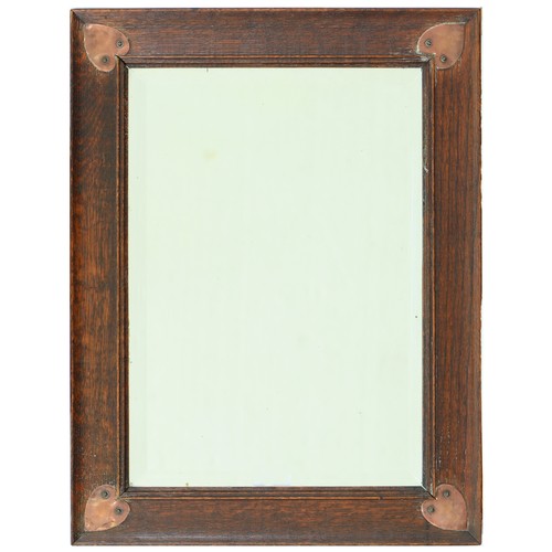 Appraisal: An Arts Crafts oak mirror c the bevelled plate in