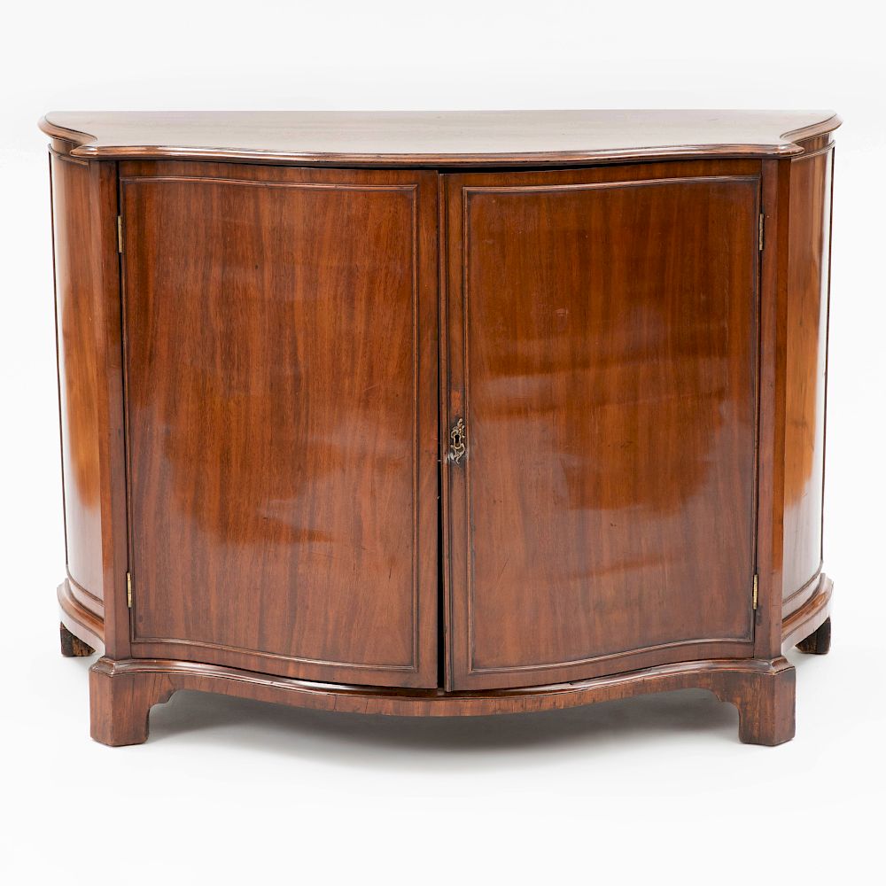 Appraisal: George III Mahogany Serpentine-Fronted Side Cabinet The serpentine-fronted top with