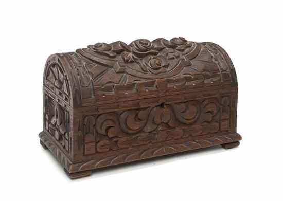 Appraisal: A Carved Walnut Table Casket of rectangular form having a