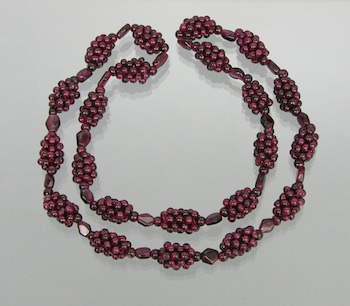 Appraisal: A Vintage Garnet Bead Necklace Garnet bead necklace hand-knotted in