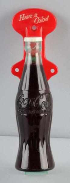 Appraisal: Plastic Coca-Cola Bottle-Shaped Screen Door Pull Description s Clean and