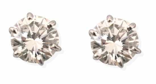 Appraisal: A PAIR OF DIAMOND STUD EARRINGS Each round brilliant cut