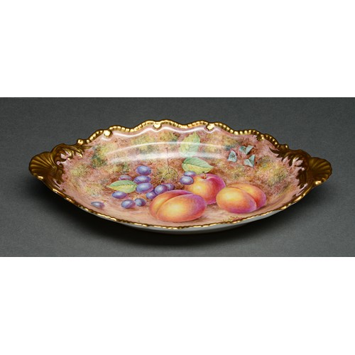 Appraisal: A Royal Worcester shell handled oval dessert dish c painted