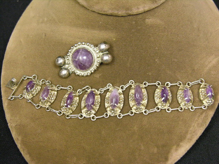 Appraisal: SILVER AND AMETHYST STONE BRACELET AND PIN Opaque amethyst colored