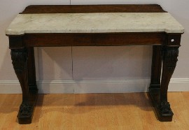 Appraisal: A Regency mahogany console table with marble top on scrolled