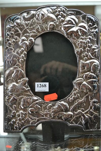 Appraisal: EMBOSSED STERLING SILVER PHOTO FRAME WITH SQUIRREL MOTIF