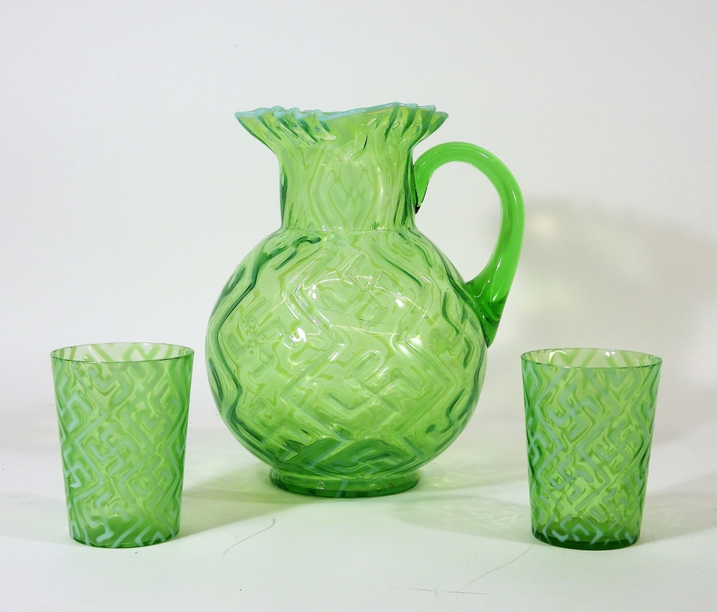 Appraisal: DUGAN OPALESCENT GLASS SWASTIKA PITCHER TUMBLERS Pennsylvania Circa Dugan Glass