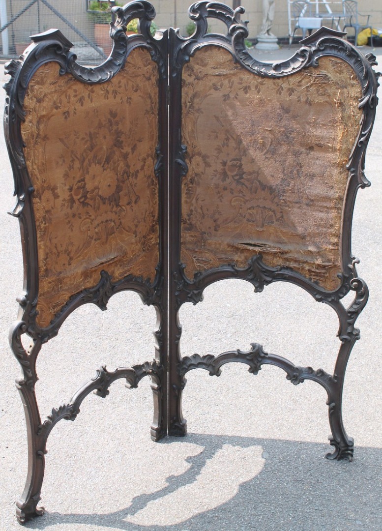 Appraisal: A late thC two fold screen with a heavily carved