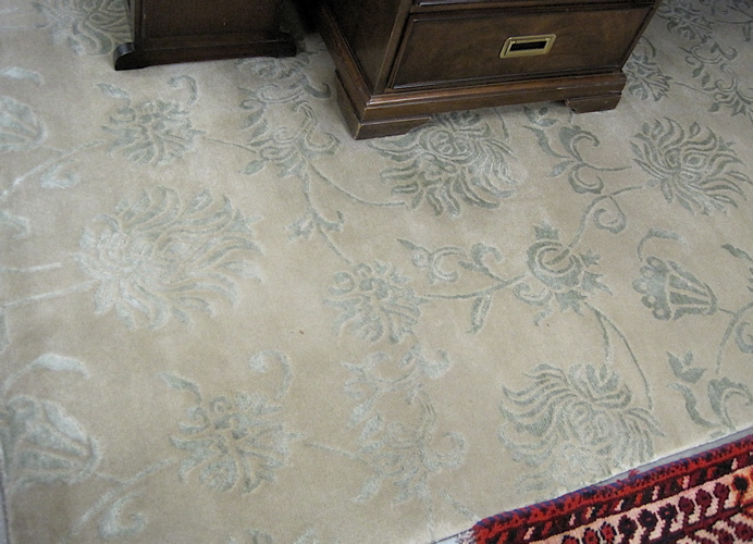 Appraisal: CONTEMPORARY HAND KNOTTED WOOL CARPET having a borderless green ground