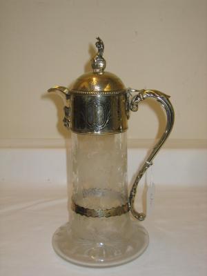 Appraisal: A VICTORIAN CLEAR GLASS CLARET JUG of swept cylindrical form