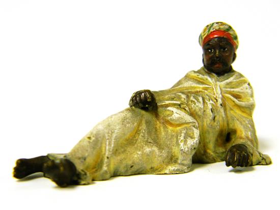 Appraisal: Franz Bergman miniature cold-painted cast bronze figurine of reclining Arab