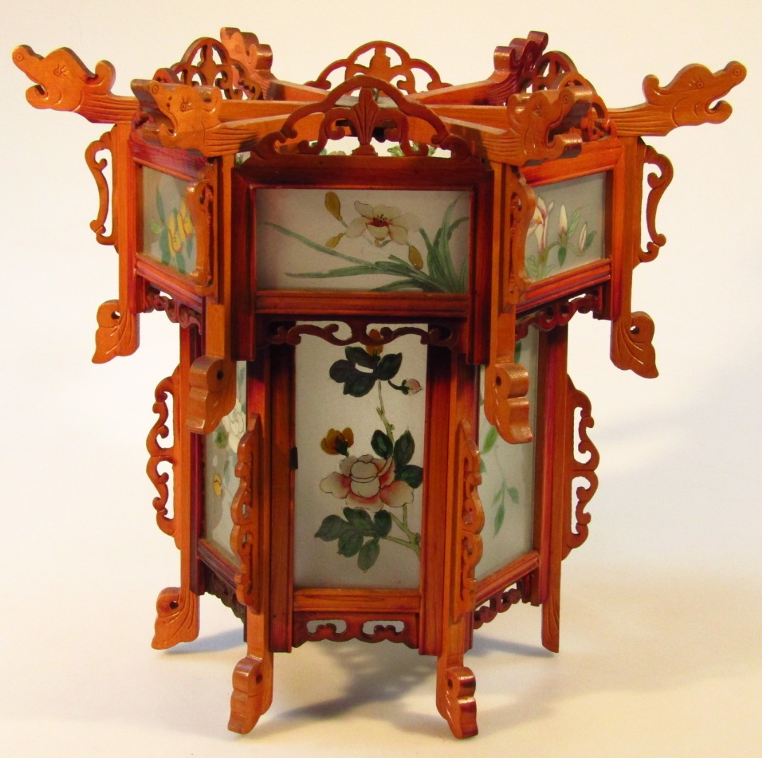 Appraisal: A thC oriental hardwood lantern shade carved to the exterior