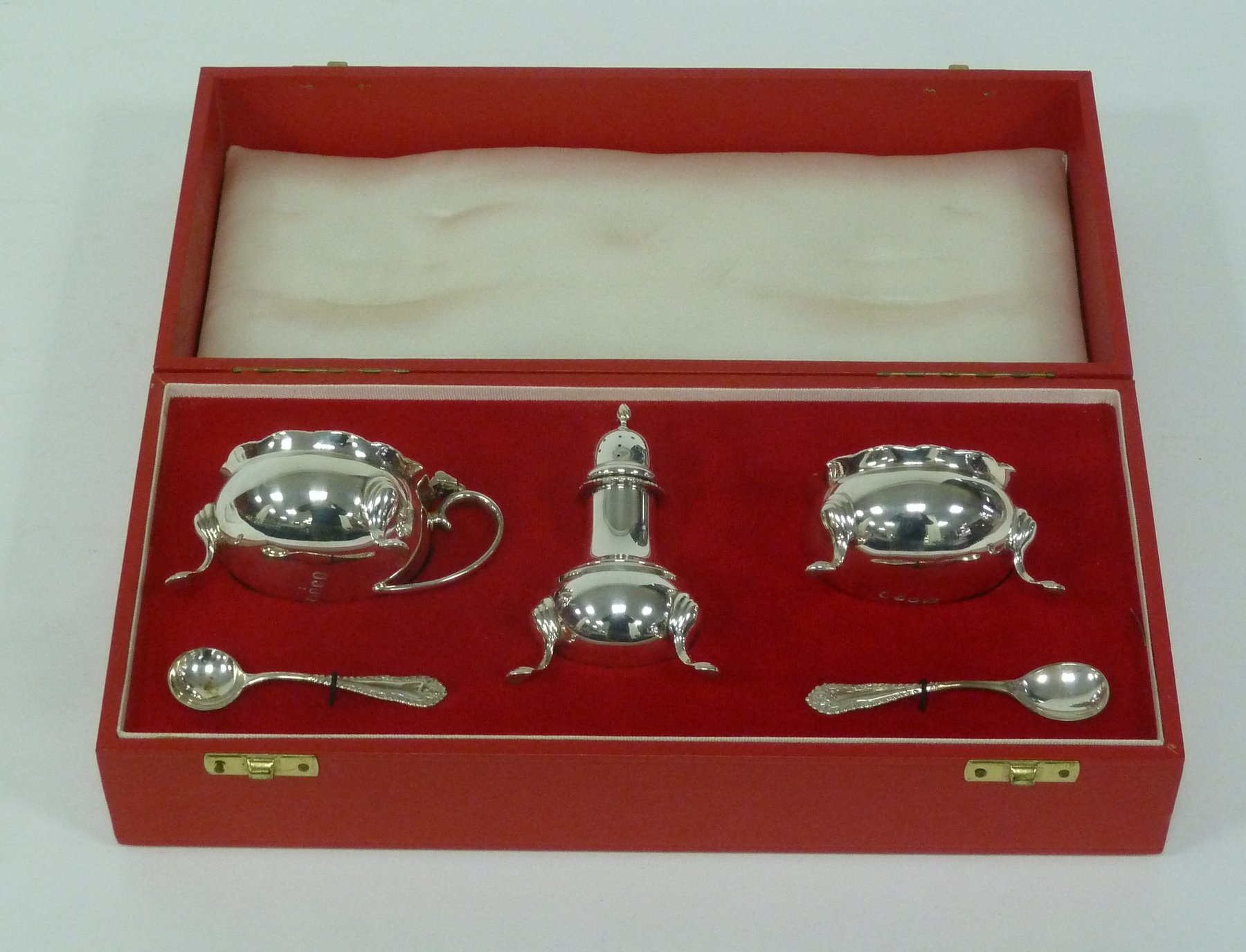 Appraisal: A three-piece silver cruet London with two spoons