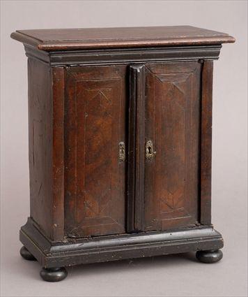 Appraisal: CONTINENTAL BAROQUE INLAID WALNUT TABLE CABINET The line inlaid doors