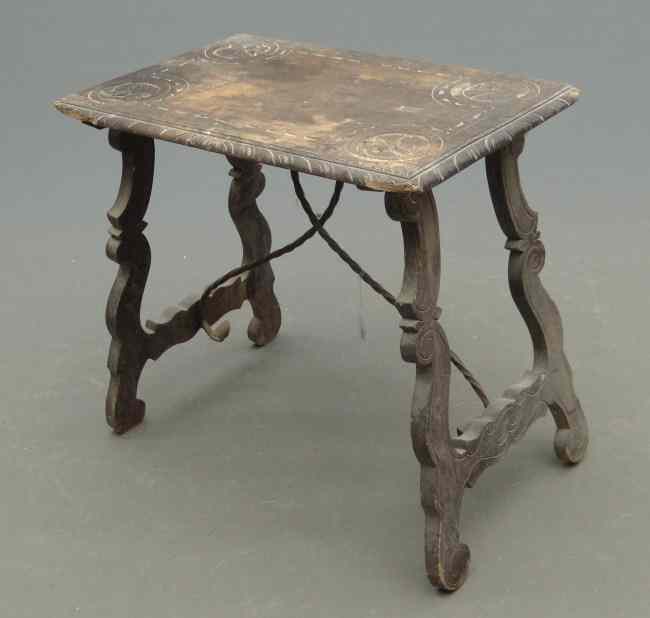 Appraisal: Continental table with iron support and carved top '' W