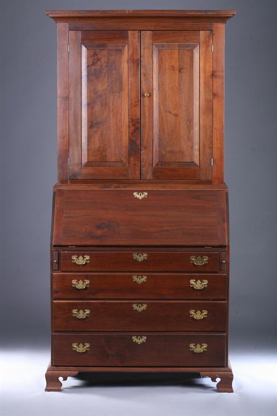 Appraisal: CHIPPENDALE STYLE CHERRY BOOKCASE-SECRETARY CABINET th century Projecting cove-molded crown