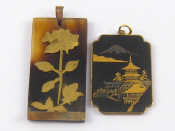 Appraisal: A gilt metal Japanese damascene pendant depicting a temple with