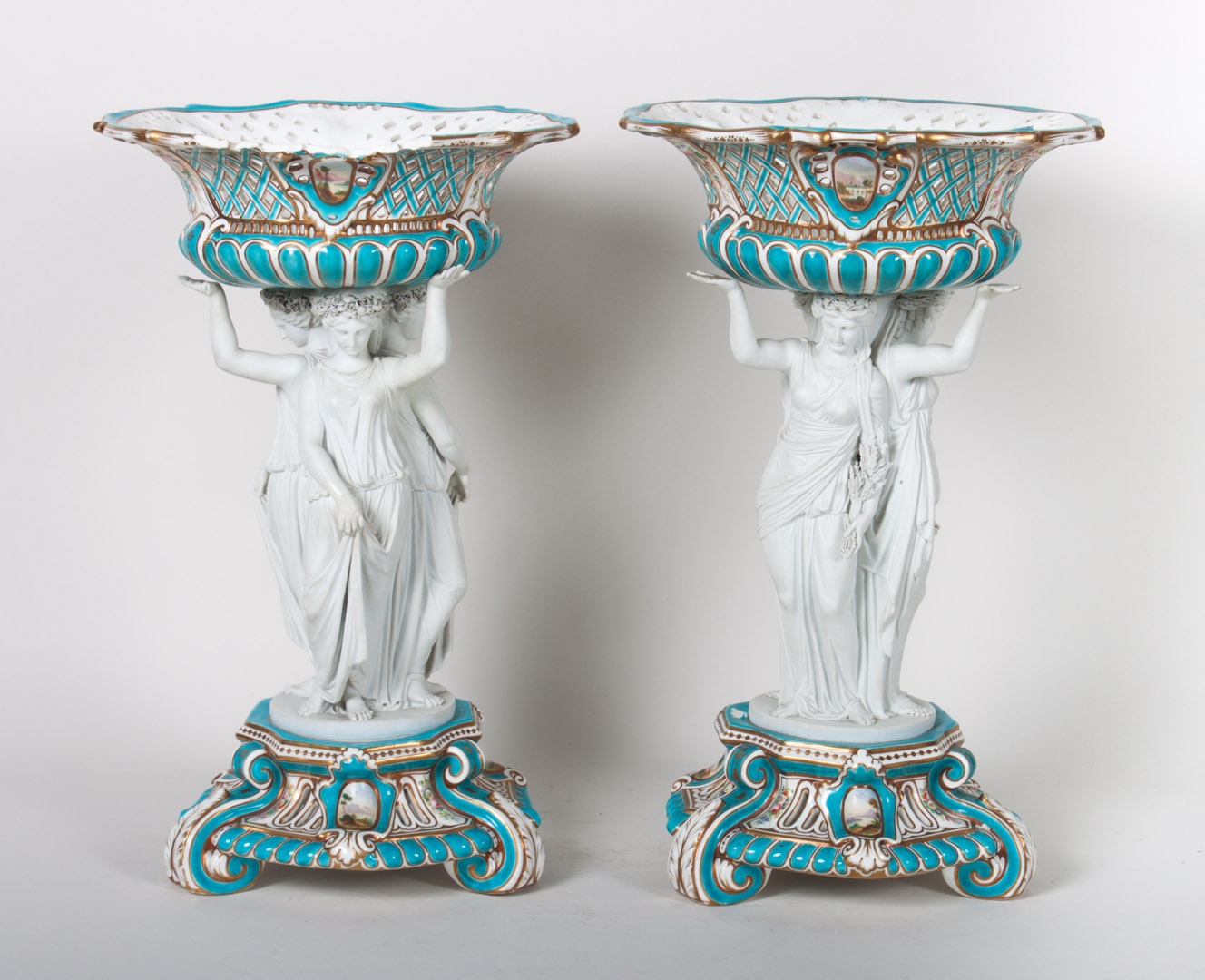 Appraisal: Pair of china and bisque figural compotes probably Minton second