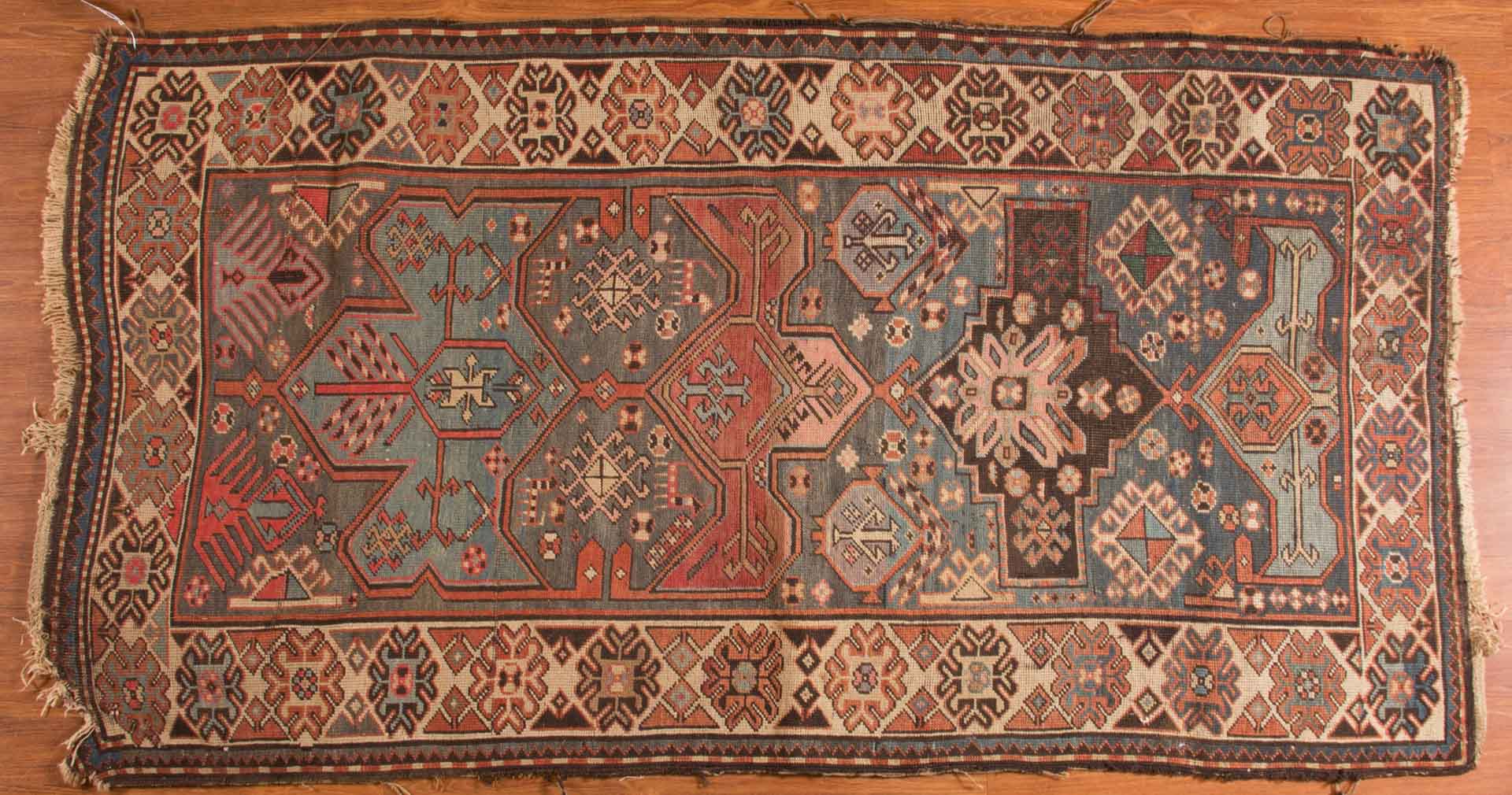 Appraisal: Antique Caucasian rug approx x Caucasus circa Condition Corner damage