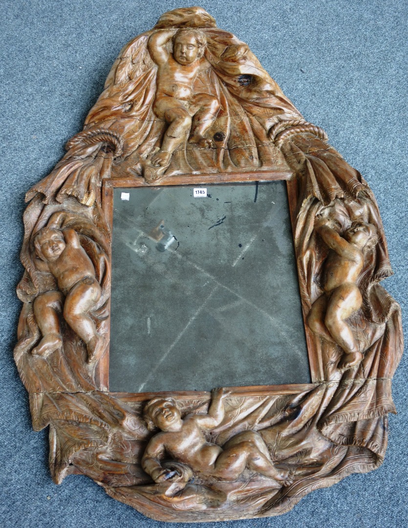 Appraisal: A th century Italian wall mirror in an extensive carved