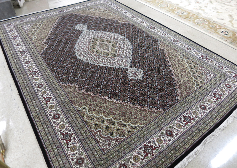 Appraisal: HAND KNOTTED ORIENTAL CARPET Persian Bidjar design central medallion and