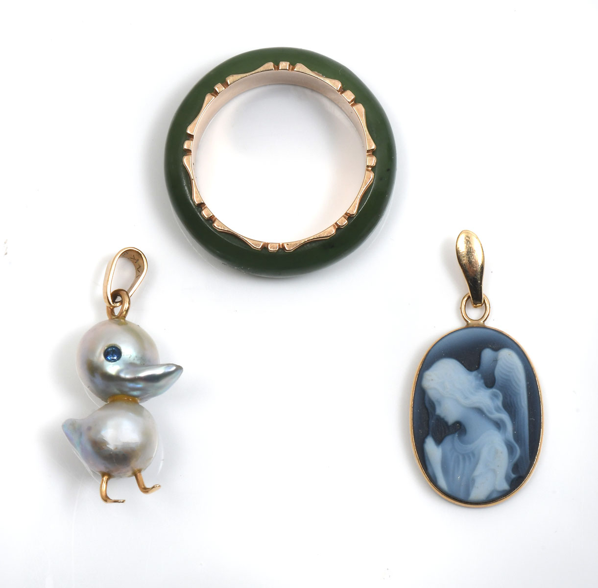 Appraisal: PIECE- JADE RING CAMEO PEARL DUCK K yellow gold band