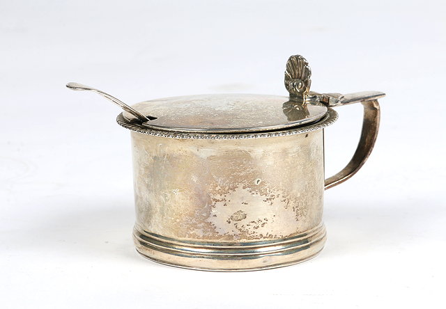 Appraisal: A GEORGE IV CAN SHAPED SILVER MUSTARD POT with gadrooned