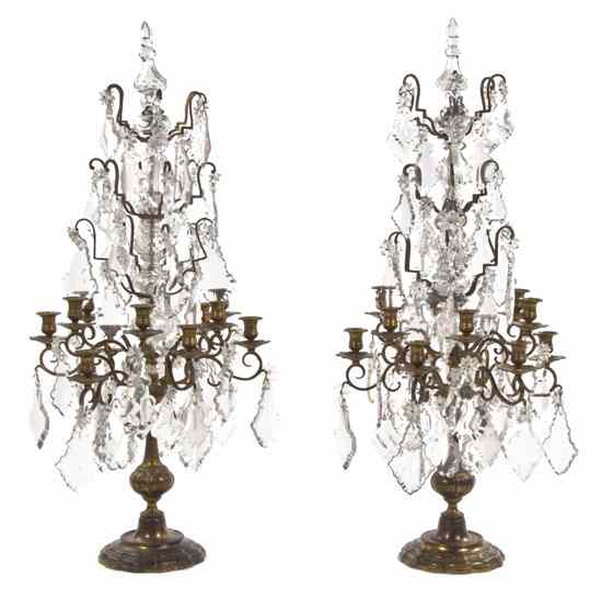 Appraisal: A Pair of Continental Gilt Bronze Twelve-Light Candelabra each having