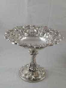 Appraisal: A large and impressive table centrepiece tazza heavily embossed and