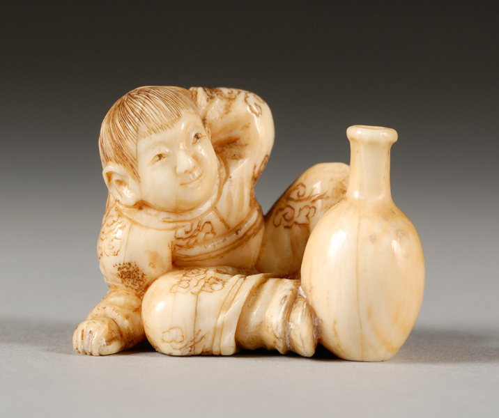 Appraisal: Ivory Carving Japan th century a small boy with a