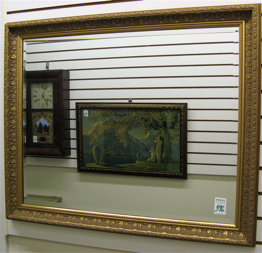 Appraisal: A RECTANGULAR WALL MIRROR having a gilt wood and molded