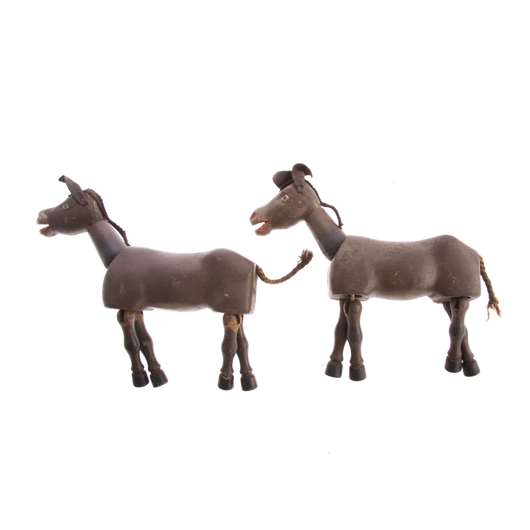 Appraisal: Two Schoenhut jointed painted wood circus donkeys circa s with