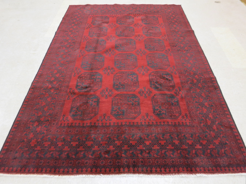 Appraisal: HAND KNOTTED ORIENTAL CARPET Afghan Ersari tribal featuring three columns