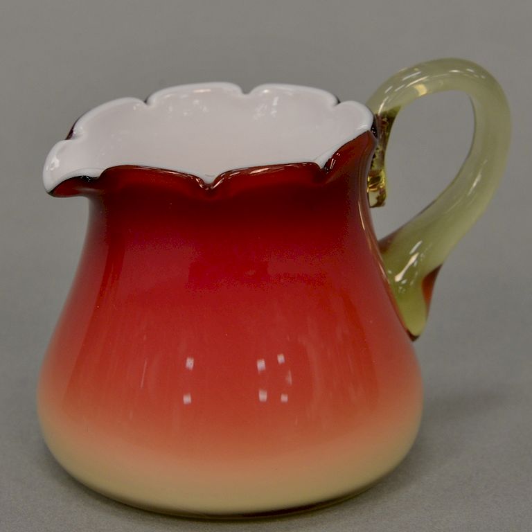 Appraisal: Amberina cased glass creamer minor roughness under top at the