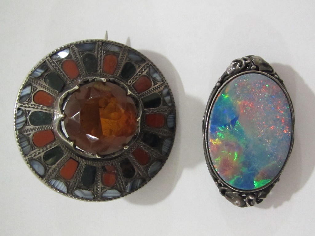 Appraisal: Lot comprising an Art Crafts oval opal brooch in foliate