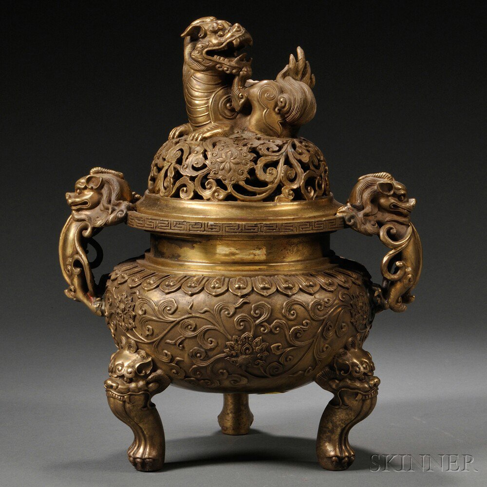 Appraisal: Bronze Tripod Censer China with lion-shaped handles and finial decorated