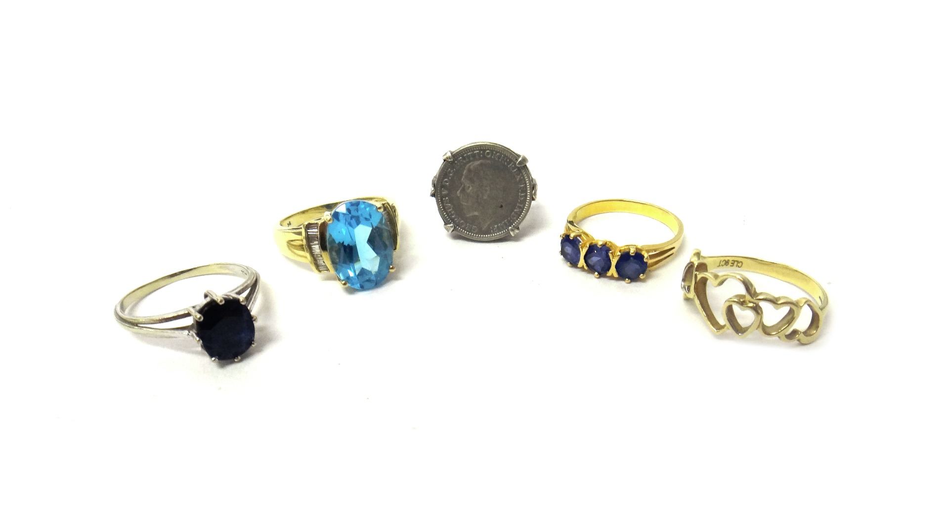 Appraisal: A gold and blue gem set three stone ring a