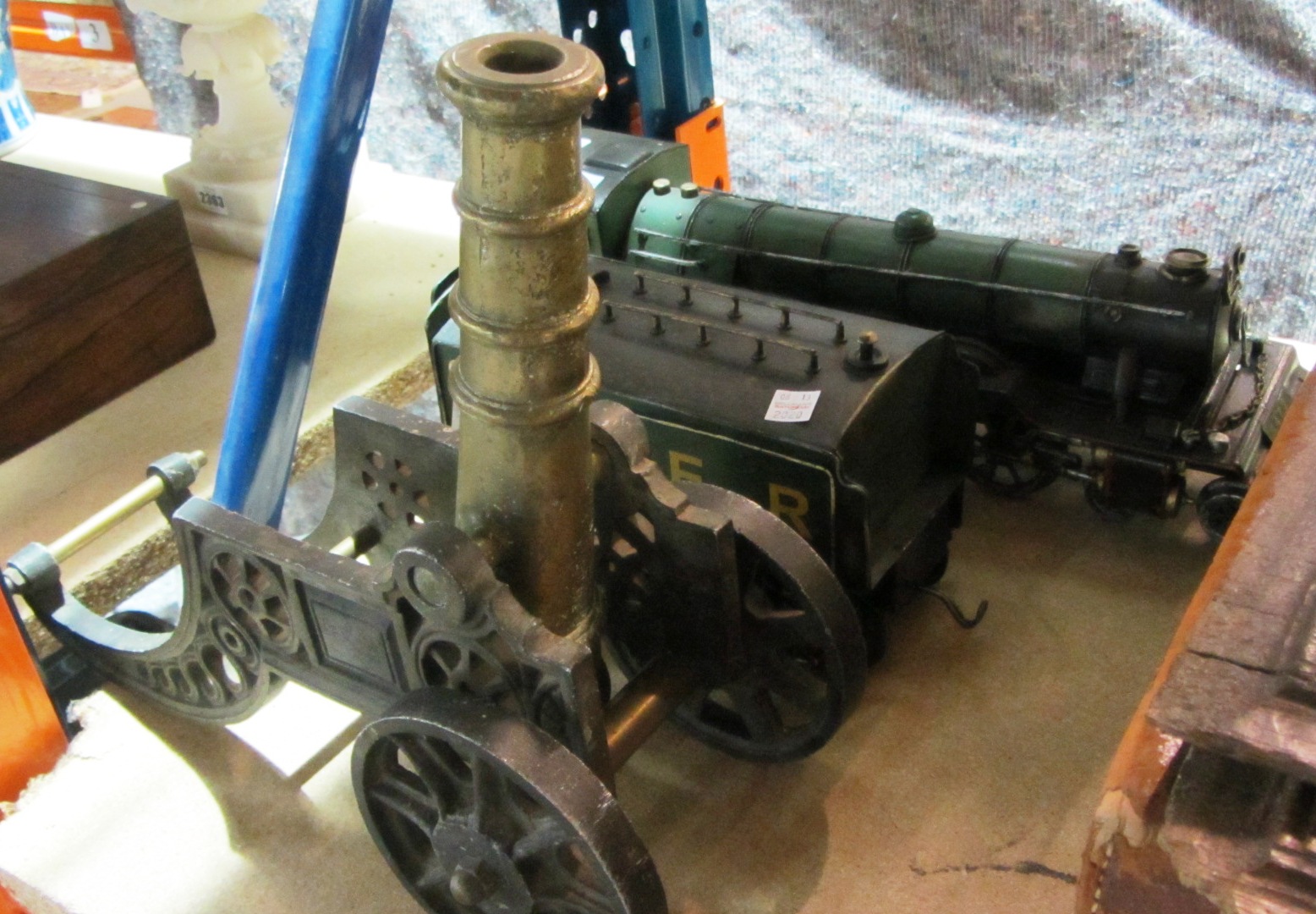 Appraisal: A th century tin locomotive and a brass cannon