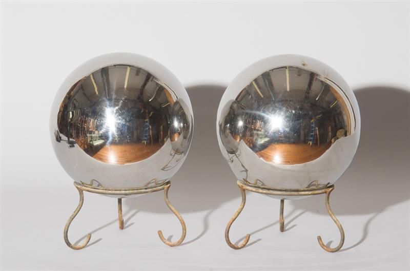 Appraisal: TWO GLASS GARDEN GAZING BALLS ON WROUGHT IRON STANDS in