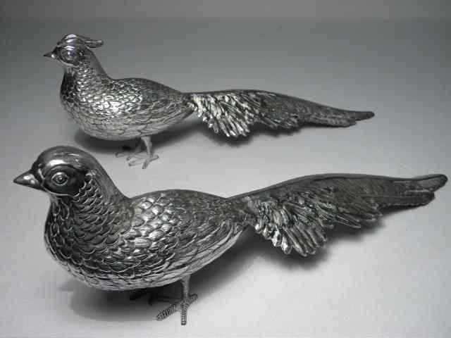 Appraisal: Pair of Spanish sterling silver pheasant sculptures Includes male and