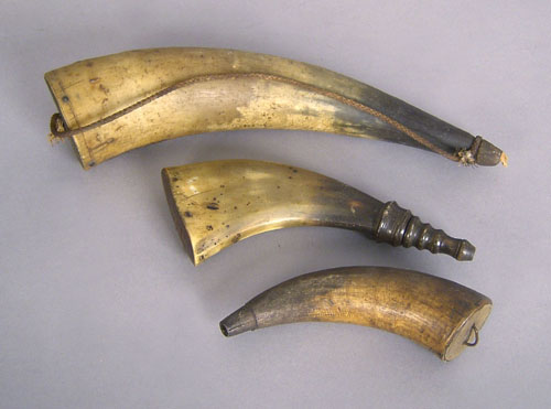 Appraisal: Three powderhorns th c one inscribed PA US Munro