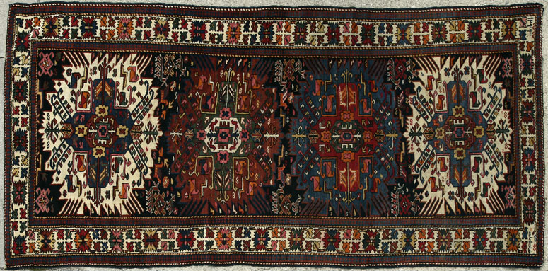 Appraisal: A Caucasian wool rug runner A Caucasian wool rug runner