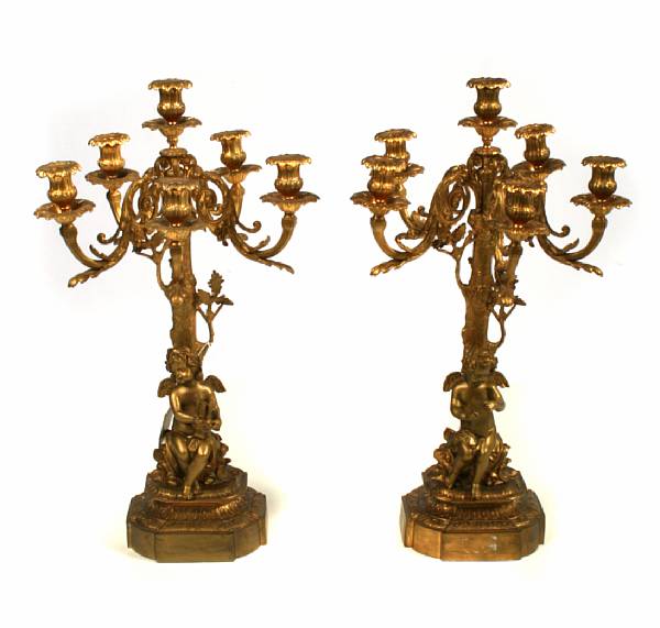 Appraisal: A pair of gilt bronze figural candelabra height in diameter